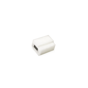 A small, white, rectangular plastic object from the B12450 Series with a black rectangular slot or opening on one side, set against a plain white background&mdash;ideal for applications as a Magnetic Float Switch. by Standex Detect