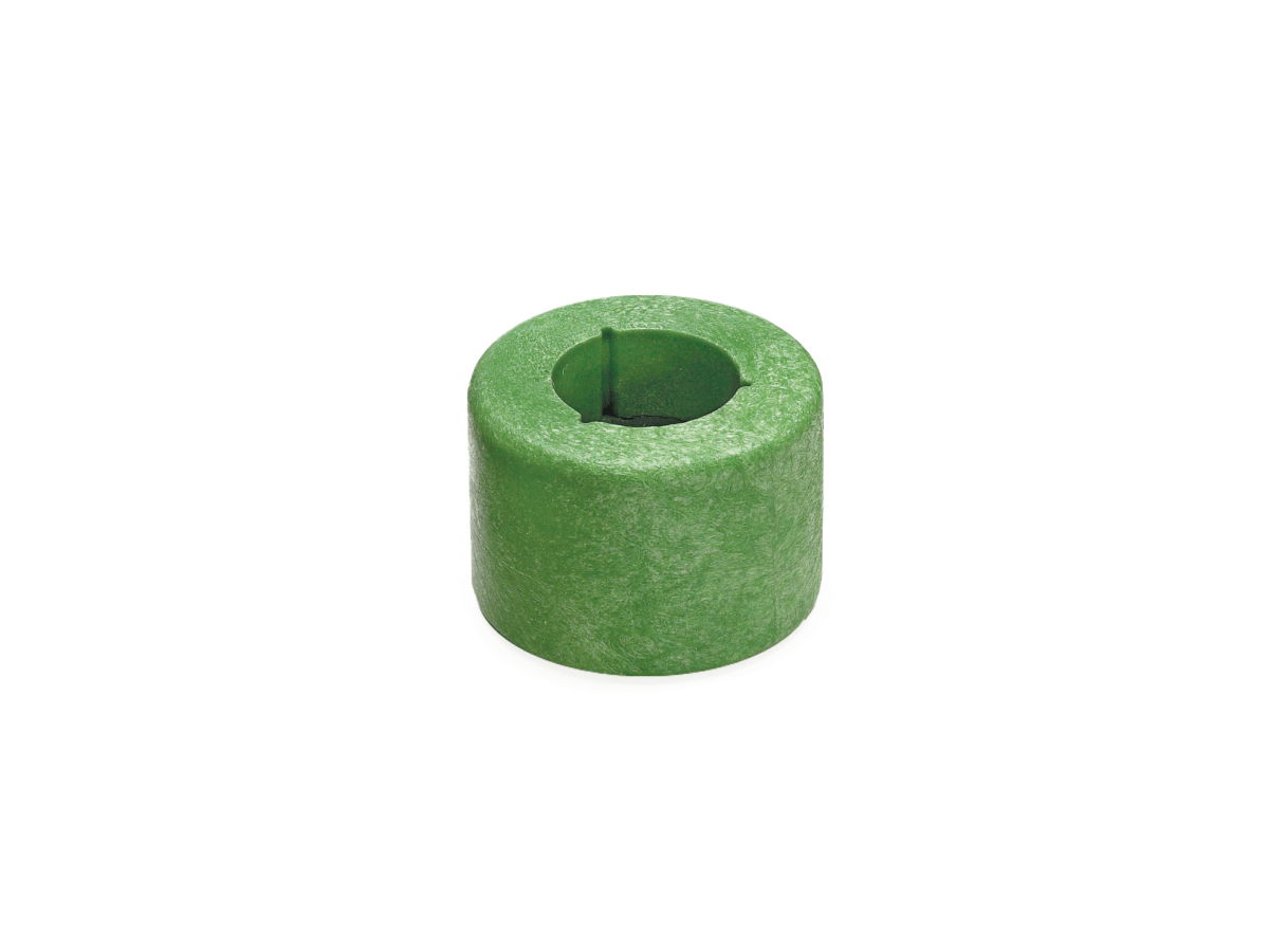 A green cylindrical foam magnetic float from the B12469 Series, featuring a hollow center and a slit running from the edge to the hole in the middle, is placed on a white background. by Standex Detect