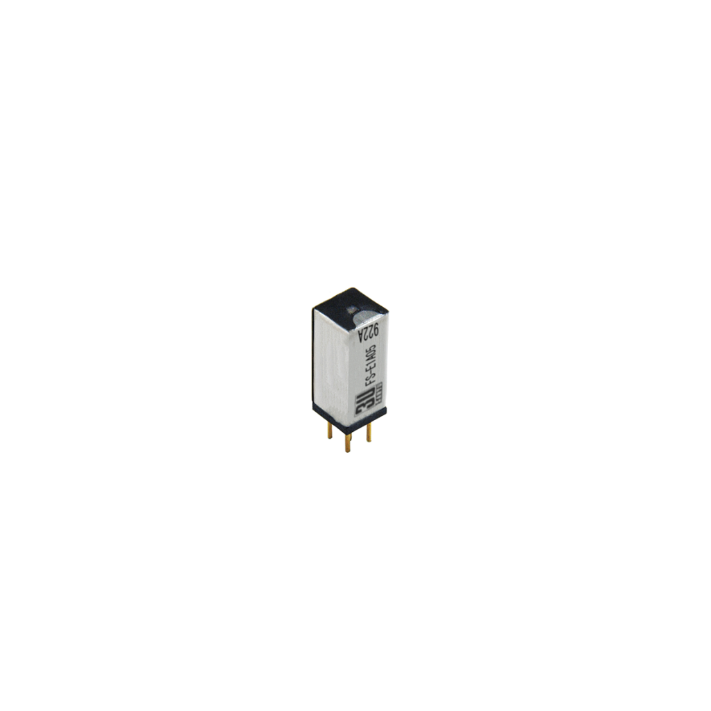 A small rectangular FS Series Reed Relay with a silver body, black top, and three gold pins at the bottom, isolated on a white background. by Standex Detect