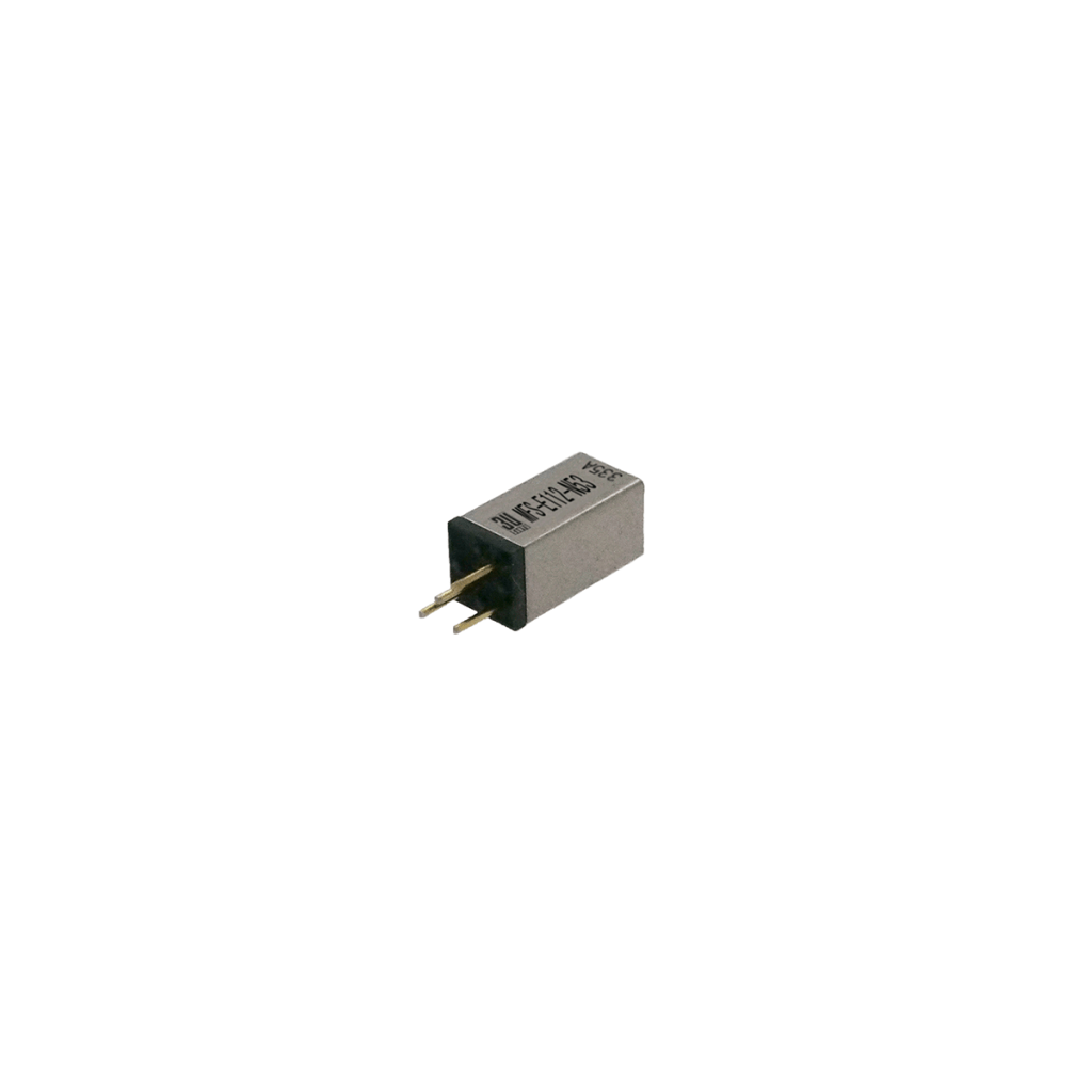 A small rectangular electronic component, such as an MFS Series Reed Switch, with a metallic casing and two gold pins for connection, isolated on a white background. The casing has black text and numbers printed on it. by Standex Detect