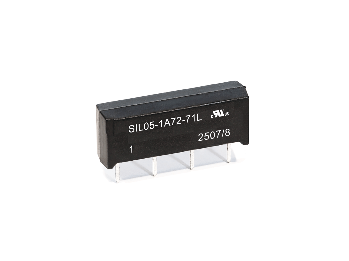 A black SIL Series Reed Relay electronic component with four metal pins, labeled SIL05-1A72-71L and 2507/8, stands on a white background. by Standex Detect