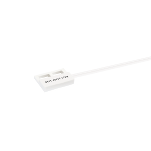 A small white rectangular MK13 Reed Sensor with two wires extending from one end, photographed on a white background. The component is marked with black text. by Standex Detect