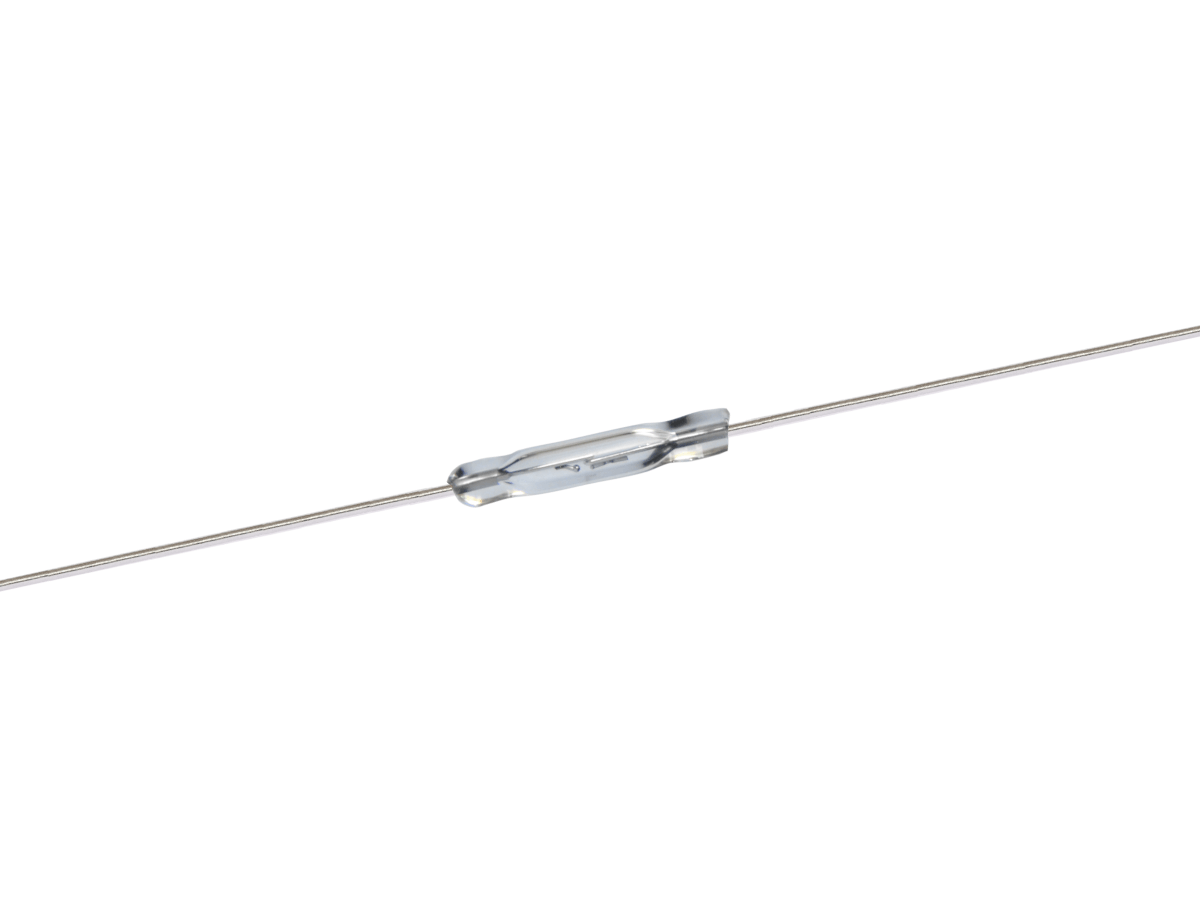 A small cylindrical PR560 Reed Switch with two long metal leads extending from each end, positioned horizontally against a white background. by Standex Detect