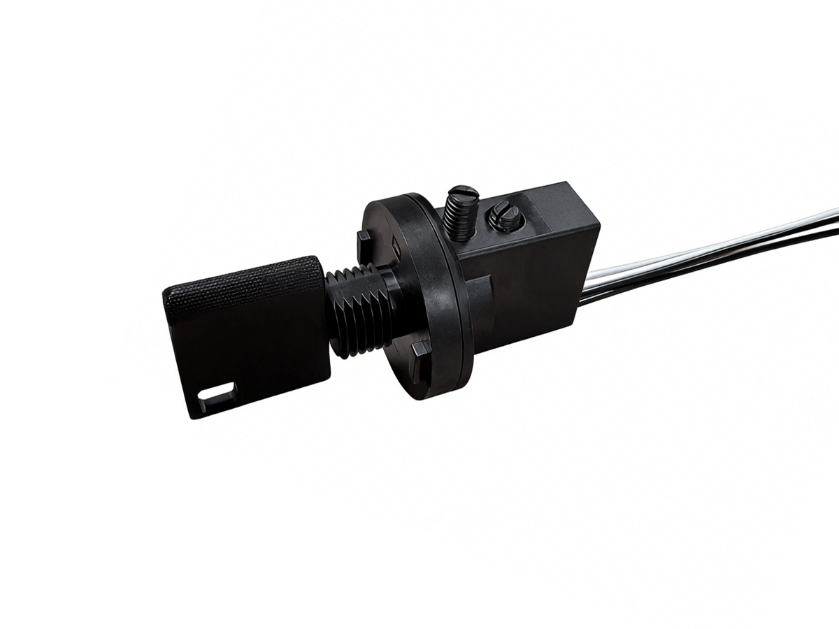 Close-up of a black KS01 Series industrial sensor or switch with a rectangular actuator, threaded mounting, and attached wires on a white background—perfect for precise reed sensor or key switch applications. by Standex Detect